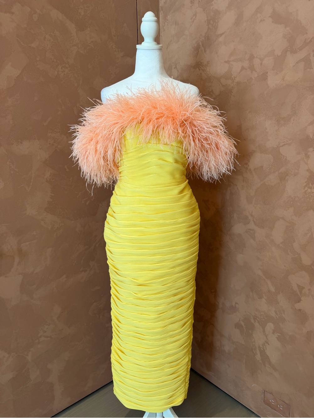 Rachel Gilbert Yellow Strapless Ruched Midi Dress with Peach Feather Trim.